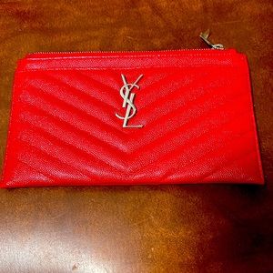 Red YSL monogram leather pouch.